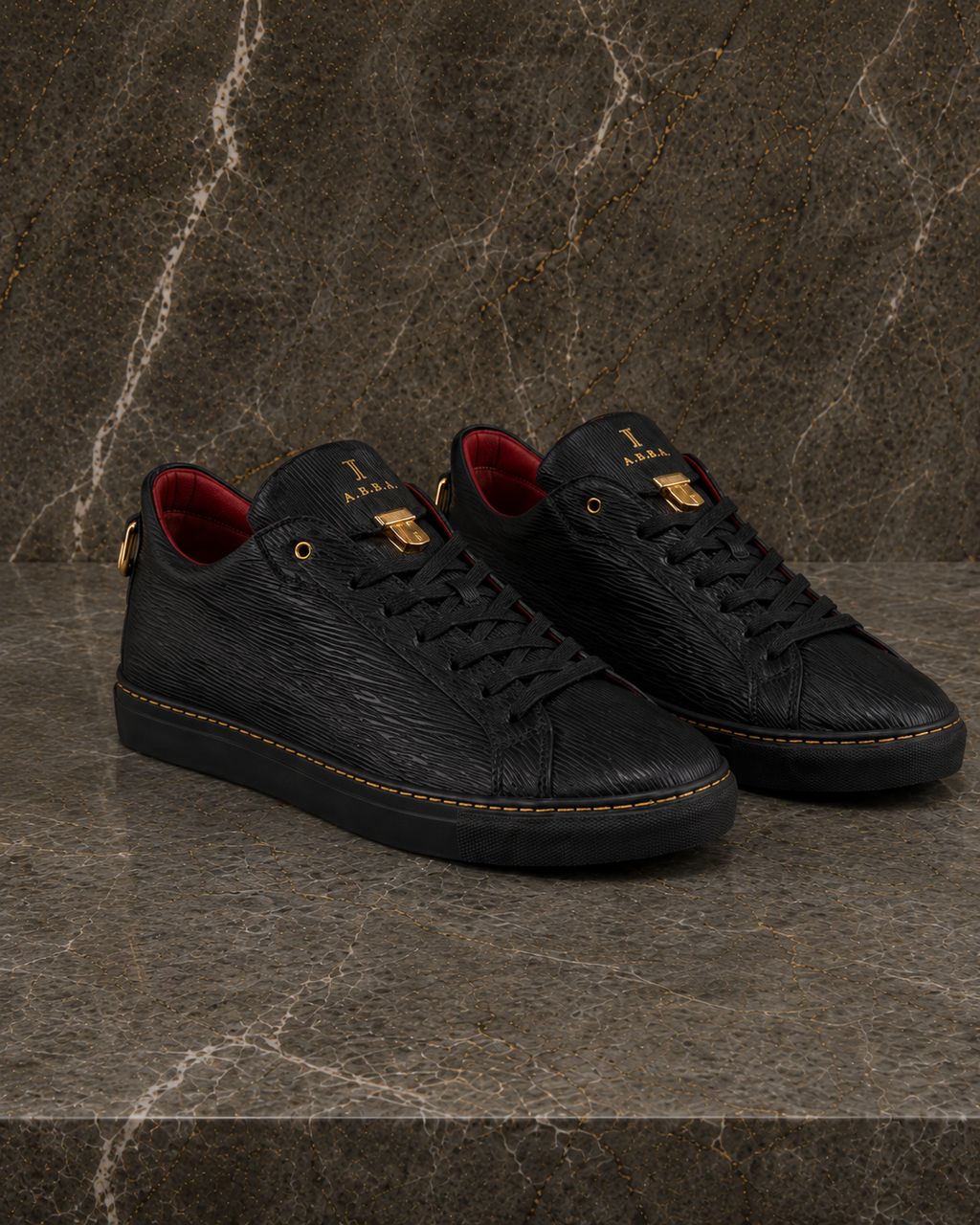 A.B.B.A. Low C.Y.B.N. black calfskin sneakers with gold details and red lining