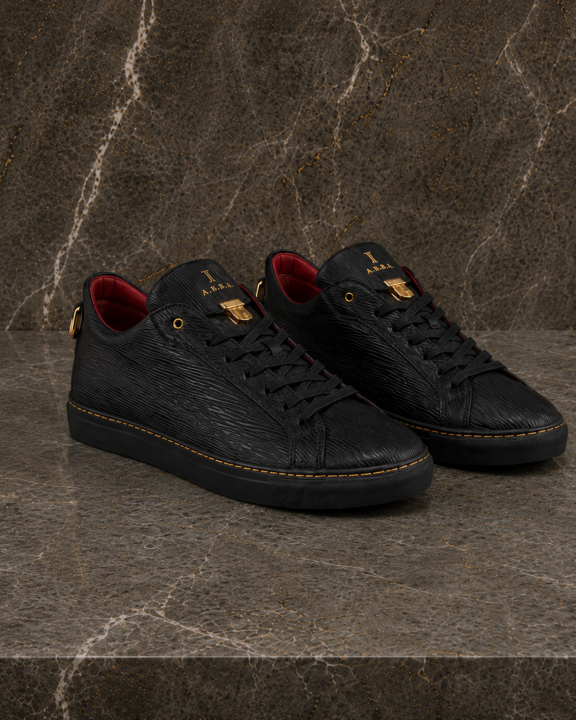 A.B.B.A. Low C.Y.B.N. black calfskin sneakers with gold details and red lining